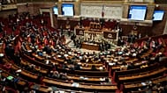 Parliament members sit as France's National Assembly vote on a national health care budget in Paris, 9 December, 2025