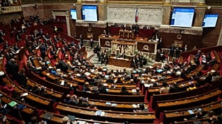 Parliament members sit as France's National Assembly vote on a national health care budget in Paris, 9 December, 2025
