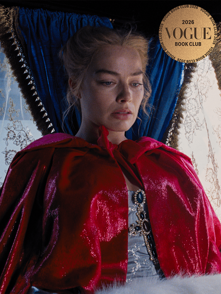 vbookclub_margot-1 Image may contain: Margot Robbie, Velvet, Adult, Person, Fashion, Cape, Clothing, Face, Head, and Formal Wear