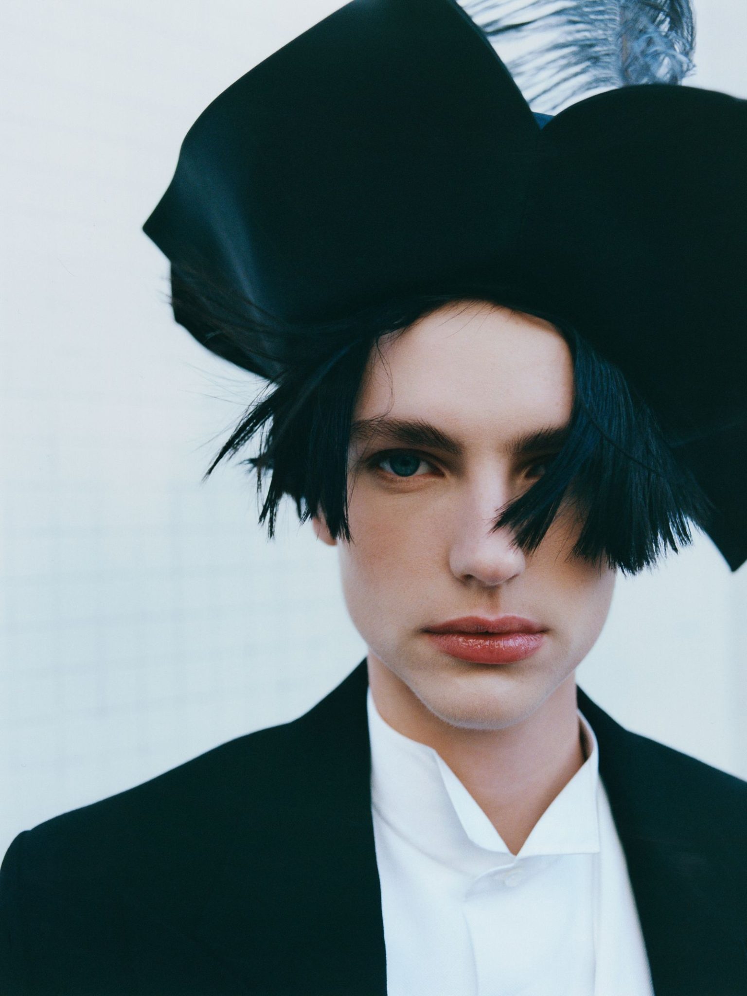 vo0326_dior_02 Image may contain Face Head Person Photography Portrait Clothing Hat Formal Wear and Suit