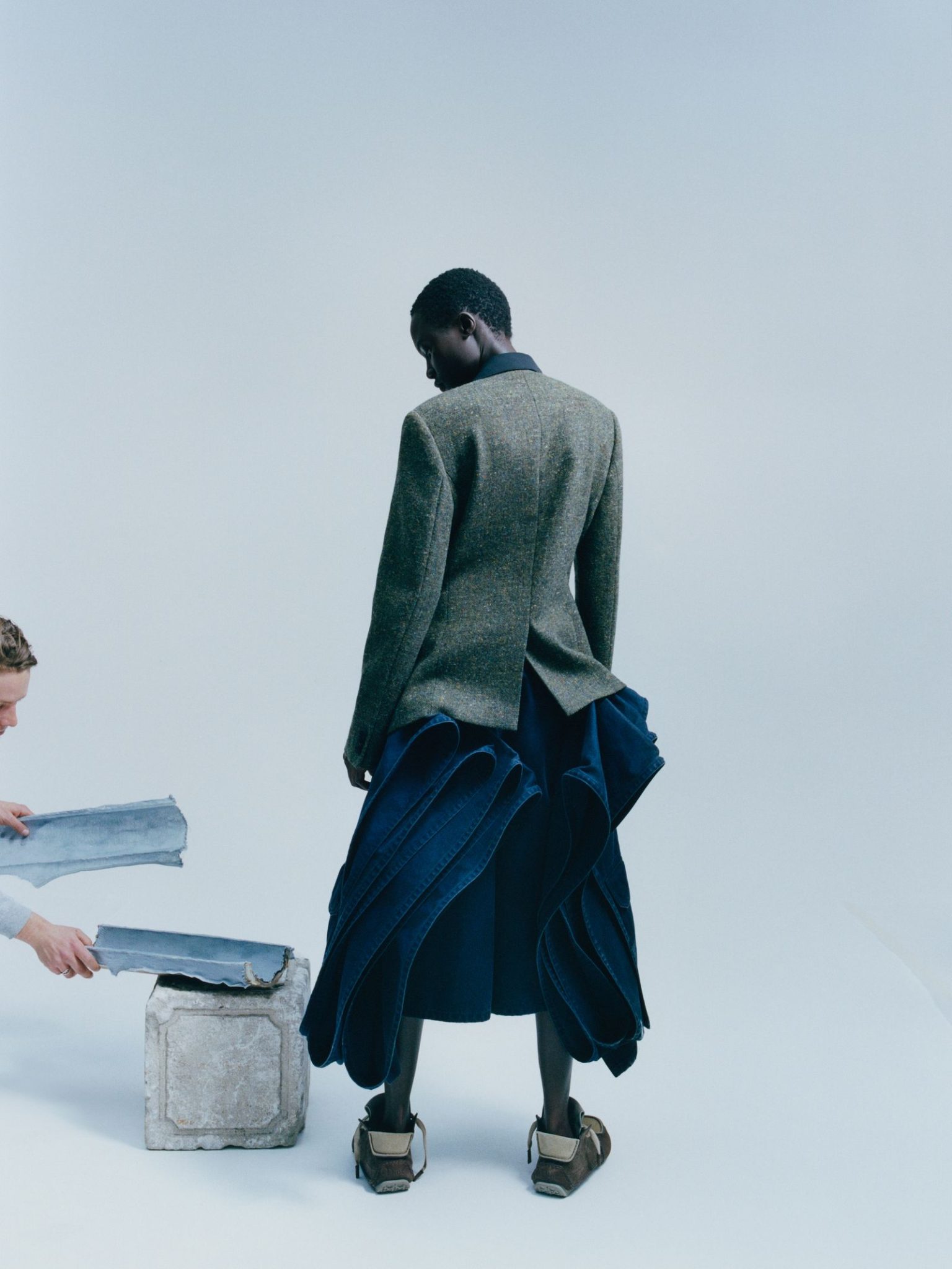 vo0326_dior_08 Image may contain Clothing Long Sleeve Sleeve Coat Adult Person Pants Footwear and Shoe