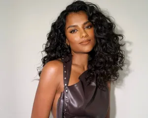 Simone Ashley with espresso brunette curls