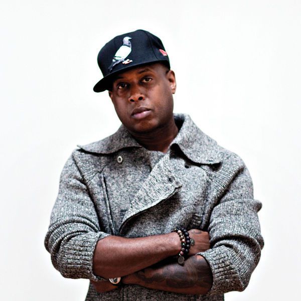 Image may contain Talib Kweli Cap Clothing Hat Baseball Cap Coat Face Head Person Photography Portrait and Jacket